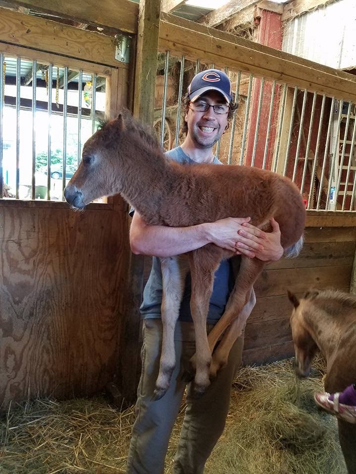 Picture of Paul Chase holding a pony named Luna.
